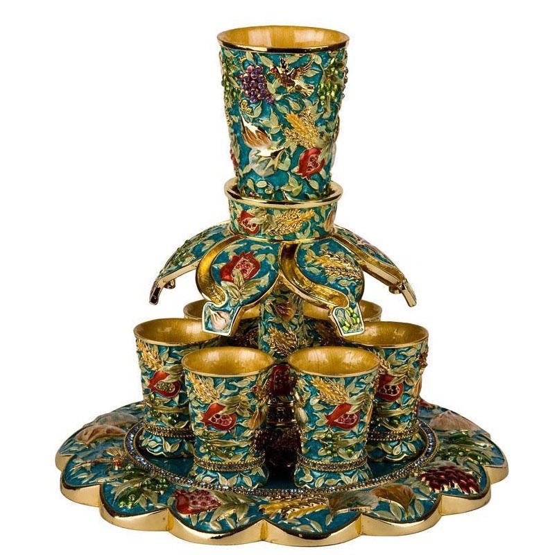 https://www.judaicawebstore.com/media/catalog/product/cache/54e028c734839e76288222a68a65f1c3/E/n/Enameled-and-Jeweled-Pewter-6-Cup-Wine-Fountain-7-Species-Turquoise_large.jpg